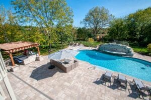 Backyard Pool Oasis Freeform Pool Design with Water Fall